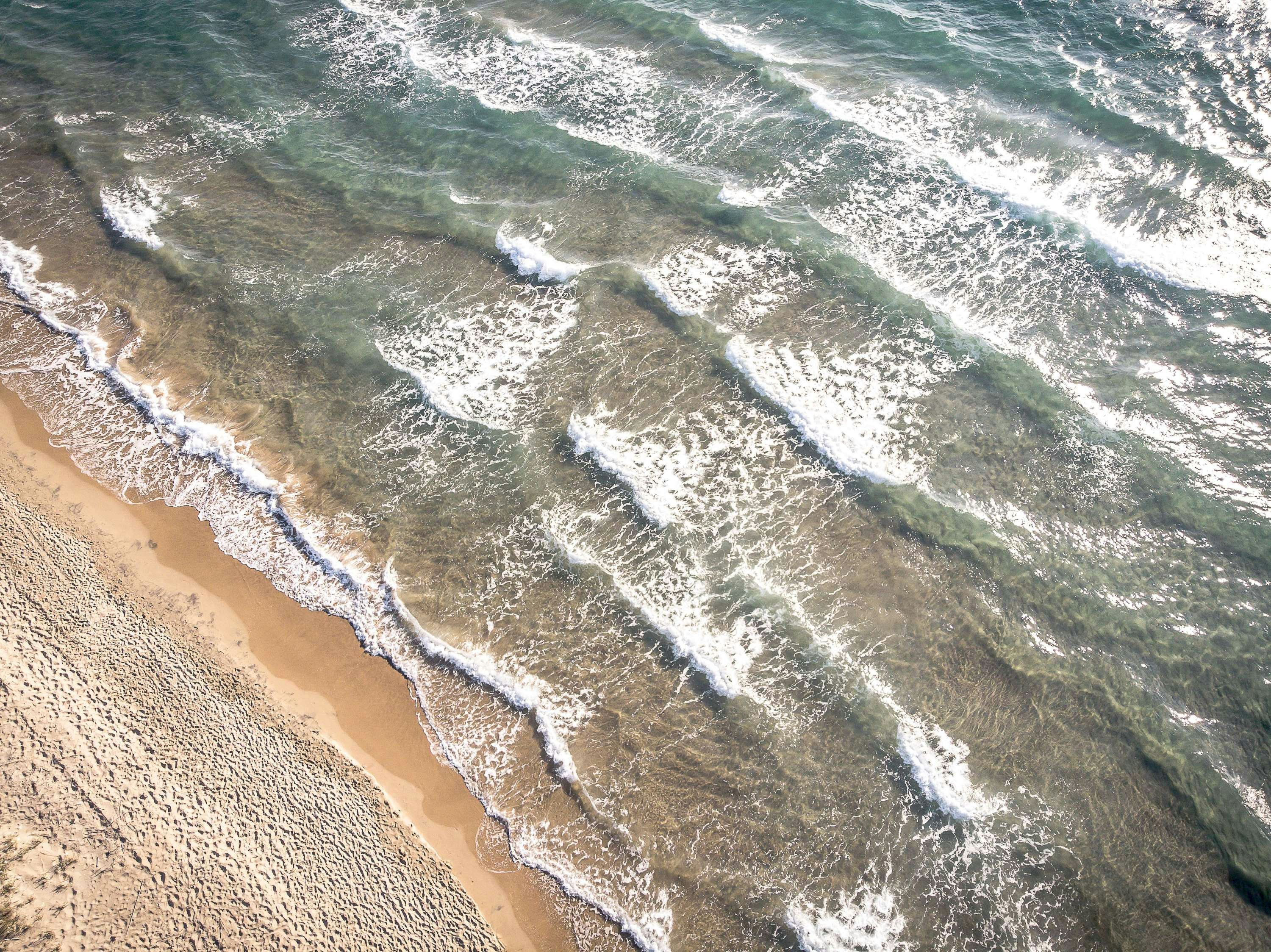 aerial view of water wave on shore